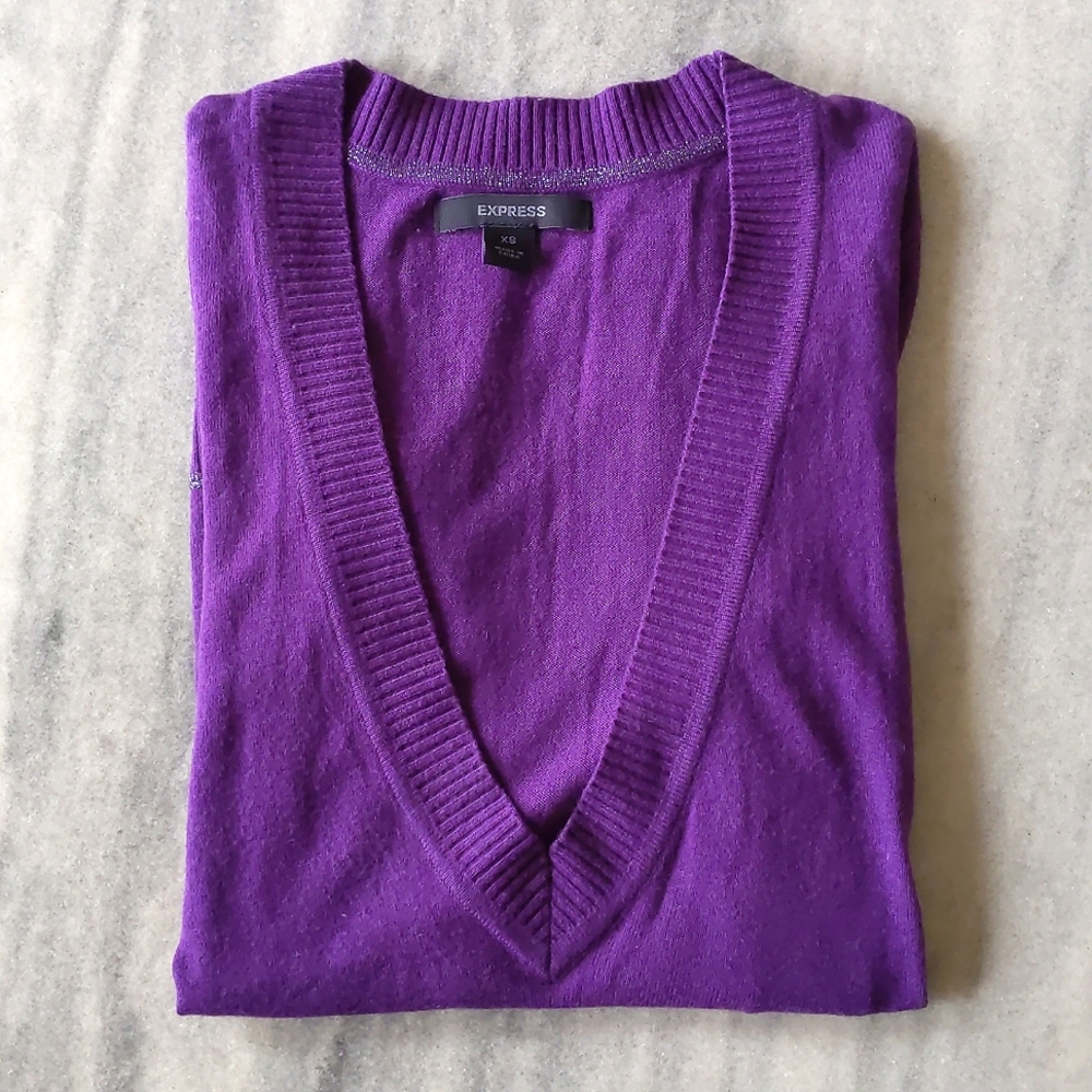Express Woman's Wool/Rayon Long V-Neck lightweight sweater with sparkling trims.